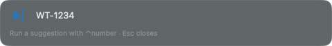 The typing window near the top of the screen with WT-1234 typed in, and the hint “Run a suggestion with ⌃number · Esc closes” underneath